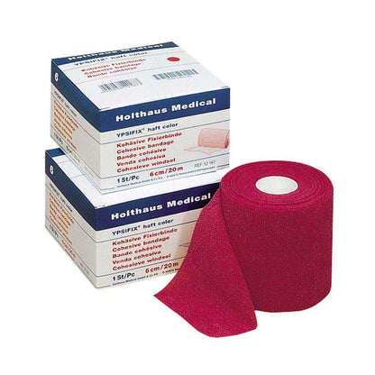 Pinkfarbene Fixierbinde YPSIFIX® haftend, als gerollte Bandrolle mit Umkartons