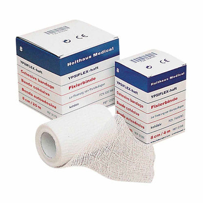 Haft-Mullbinde YPSIFLEX® haftend, elastisch: hellgraue Binde auf Rolle mit Verpackung