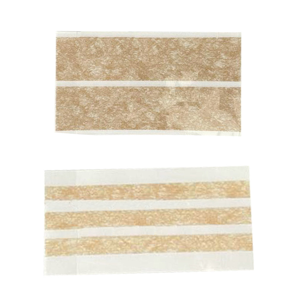 Zwei Wundnahtstreifen auf transparentem Träger, je mit beige Streifen